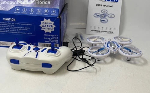 White and blue remote control stunt drone base with charging cables and spare parts