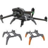 Gray quadcopter drone with orange prop guards and front camera sensor