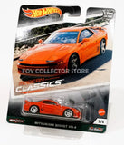 Orange diecast sports car toy with black wheels, in blister package.