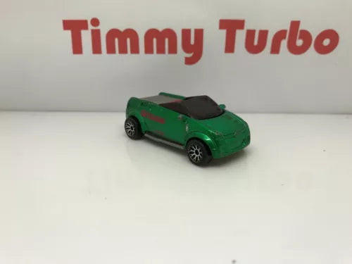 Green metallic diecast model car with black hood, front three-quarter view