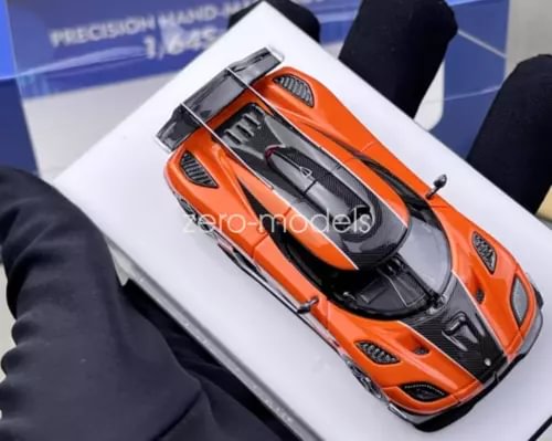 Orange and black racing sports car model with detailed front and grille