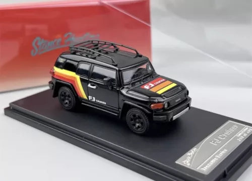 1:64 black off-road SUV diecast model car with roof rack, front three-quarter view