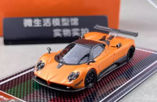 1:64 orange racing sports diecast model car with black wheels and rear wing