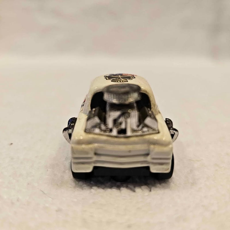 Mini diecast car, cream color, front view with open hood detail