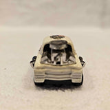 Mini diecast car, cream color, front view with open hood detail