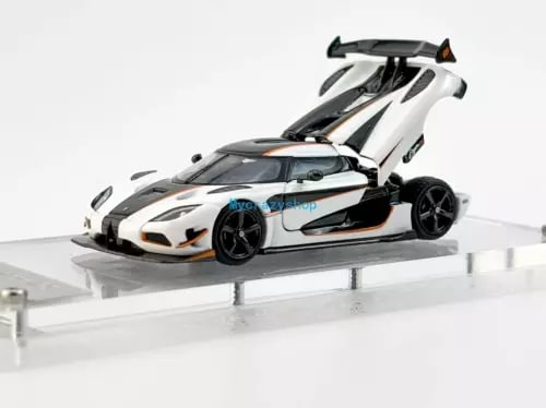 White and black racing diecast model car with large rear wing, exposed wheels