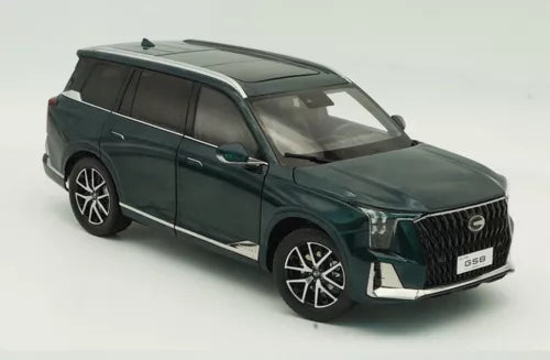 Green SUV diecast model car with open grille and black wheels