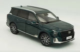 Green SUV diecast model car with open grille and black wheels