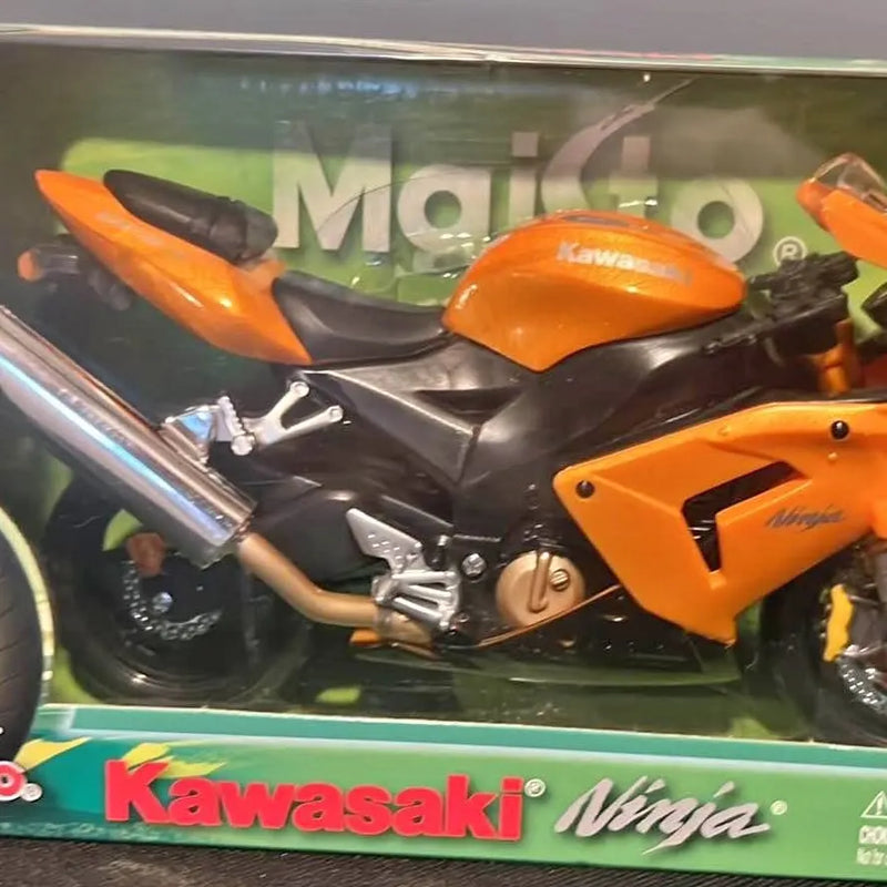 Kawasaki Ninja diecast motorcycle model, orange and black sport bike