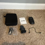 Collapsible HD camera drone kit with controller, spare battery, cables, and hard case