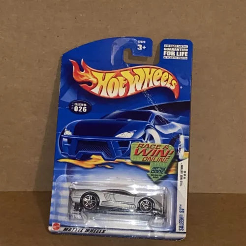 Hot Wheels diecast car on card, silver race car with black wheels