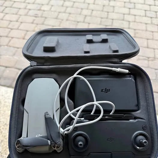 DJI drone hard case with controller and charging cables