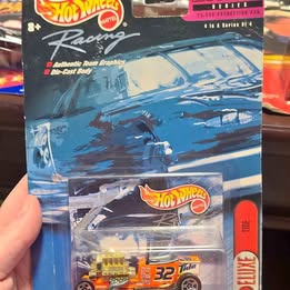 Hot Wheels diecast racing car toy in blister packaging with number 32