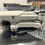 Mavic Mini drone, light gray body with front camera and propellers