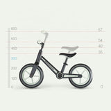 Black adjustable-seat kids balance bike with front handlebar and white wheels