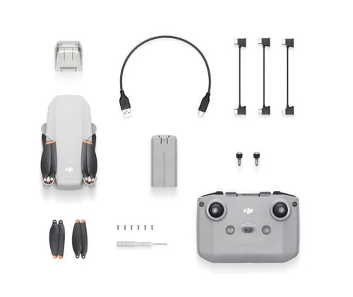 DJI Mini 2 drone with remote controller, battery, and propeller set