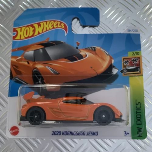 Orange and black 1:64 diecast model car in blister pack