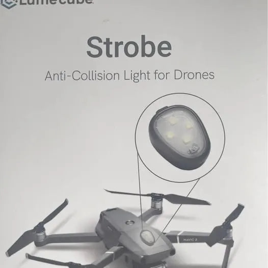 Drone strobe light module with anti-collision lens on a quadcopter