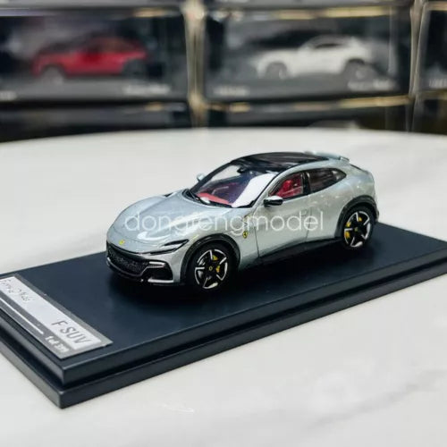 Silver 1:64 scale diecast SUV model car on black display base, detailed wheels