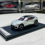 Silver 1:64 scale diecast SUV model car on black display base, detailed wheels
