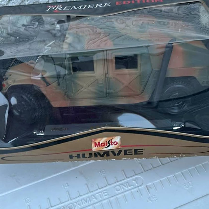 Camouflage diecast Humvee model car with Maisto HUMVEE logo