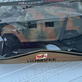 Camouflage diecast Humvee model car with Maisto HUMVEE logo