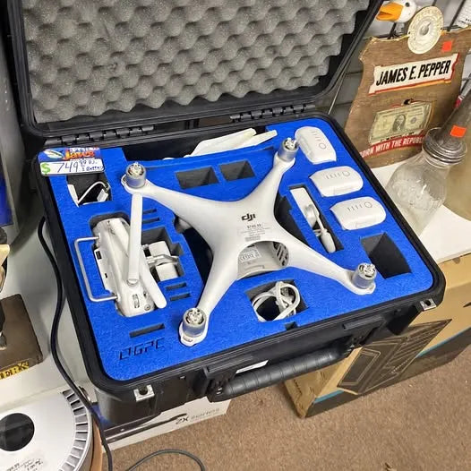 DJI drone in molded hard case with blue foam insert and white quadcopter