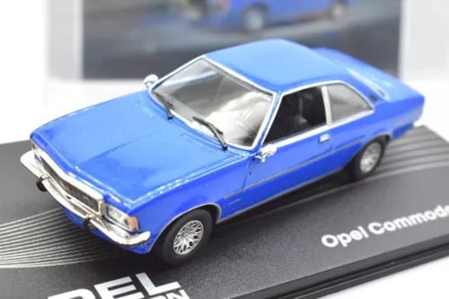 Blue 1:43 scale diecast car model with chrome details, front three-quarter view.
