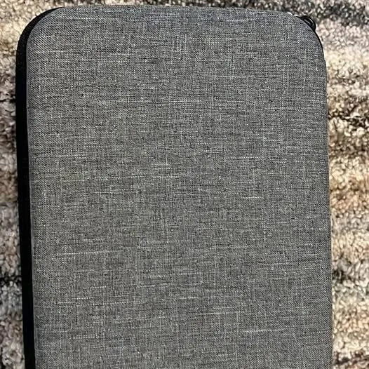 Gray padded drone case with rounded corners and dark trim