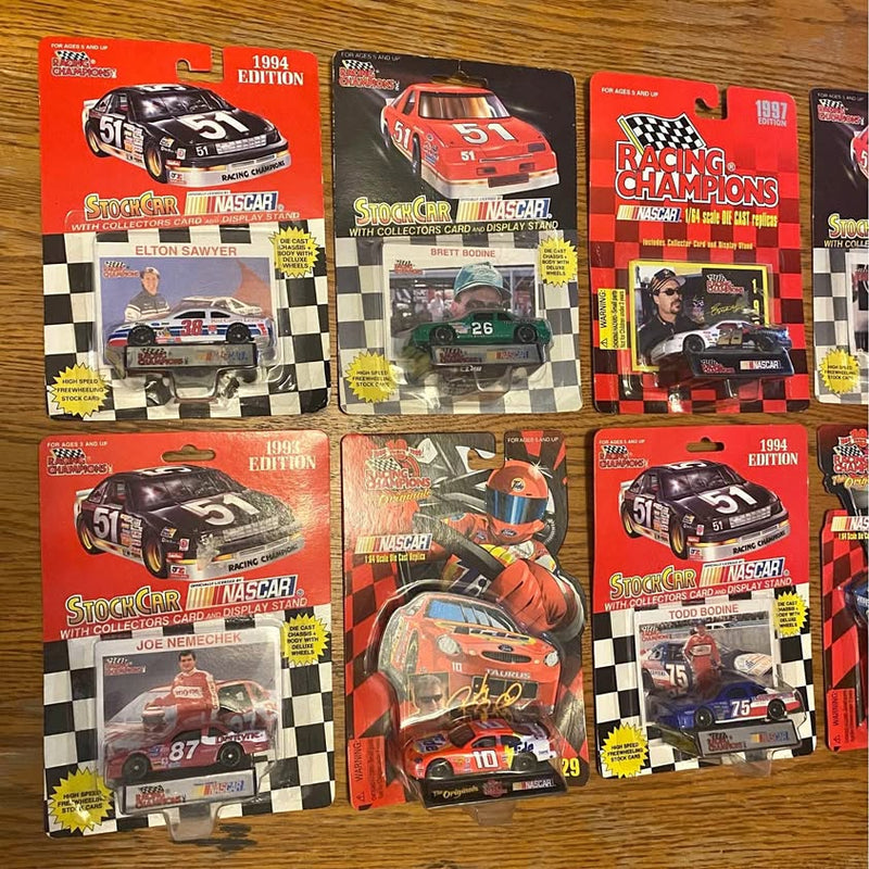 NASCAR diecast car in blister packaging, red and black race design