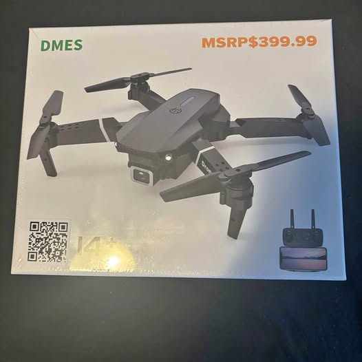 Gray quadcopter drone with remote controller, four propellers