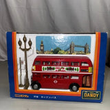 Red double-decker bus diecast toy in retail box with London artwork