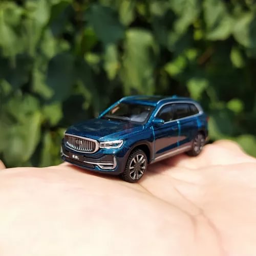 1/64 Geely Xingyue-L SUV diecast model car, blue, front 3/4 view