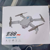 Foldable drone in retail box with 88 PRO labeling and quadcopter design