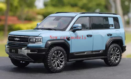 Diecast alloy SUV model car in light blue with black grille, wheels, and windows