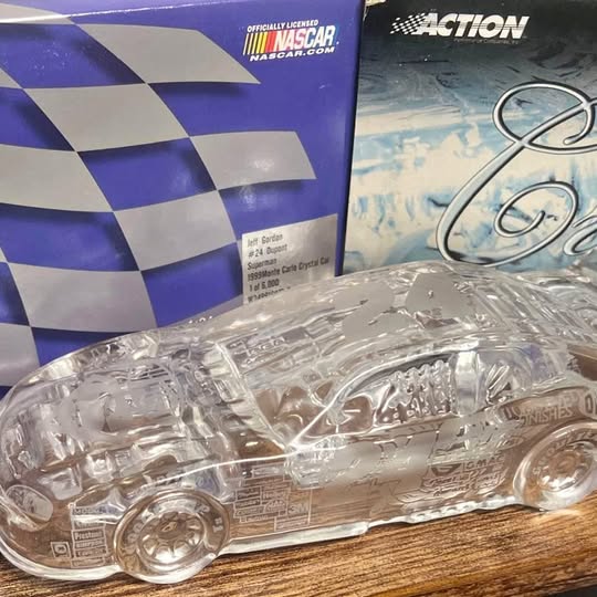 1/24 scale NASCAR diecast race car front, metallic silver with sponsor decals
