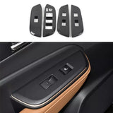 Set of dark textured interior trim panels with switch cutouts