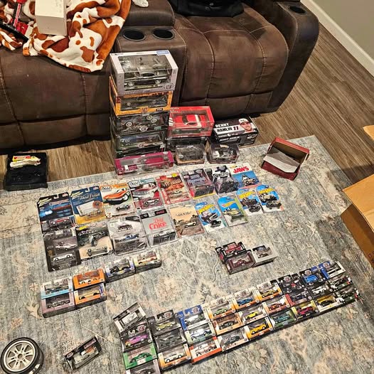 Diecast car collection Bedford IN, multiple boxed model cars on display