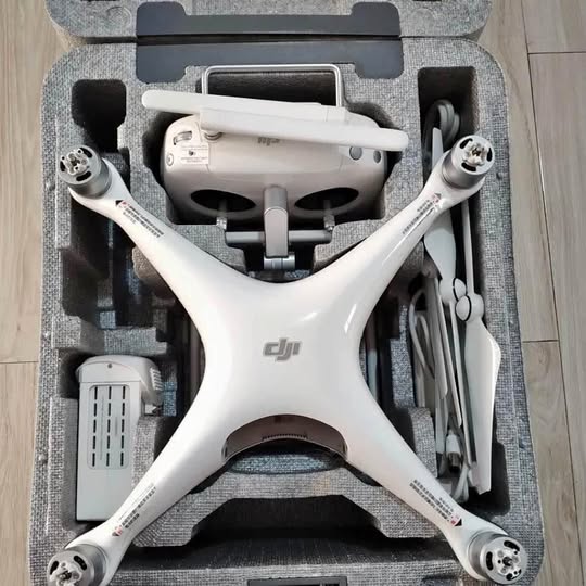 DJI drone in carrying case, white with propellers