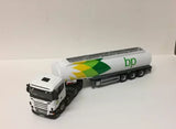Diecast BP tanker truck with white cab and green logo, black wheels and chassis