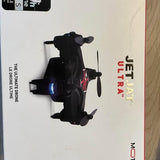 Black quadcopter drone with four arms, side view