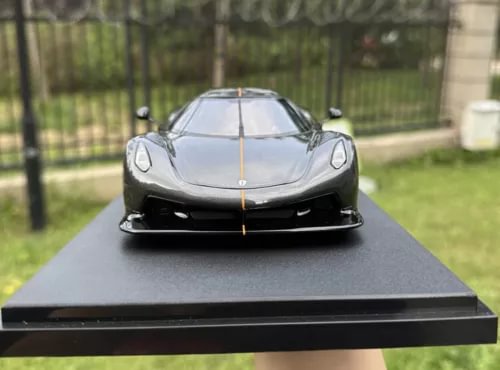 Graphite gray diecast sports car model with front splitter and headlights, hood details.