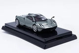 Grey diecast sports car model on black display base, 1/64 scale