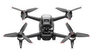 FPV drone with four propellers, gray body and black camera