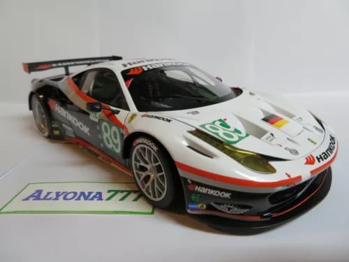 Diecast race car model in white, orange and black with number 89 graphics