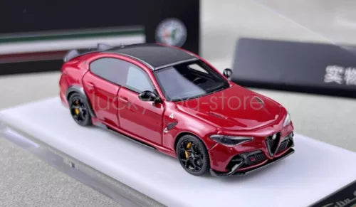 Red racing sports diecast car with black wheels and vents