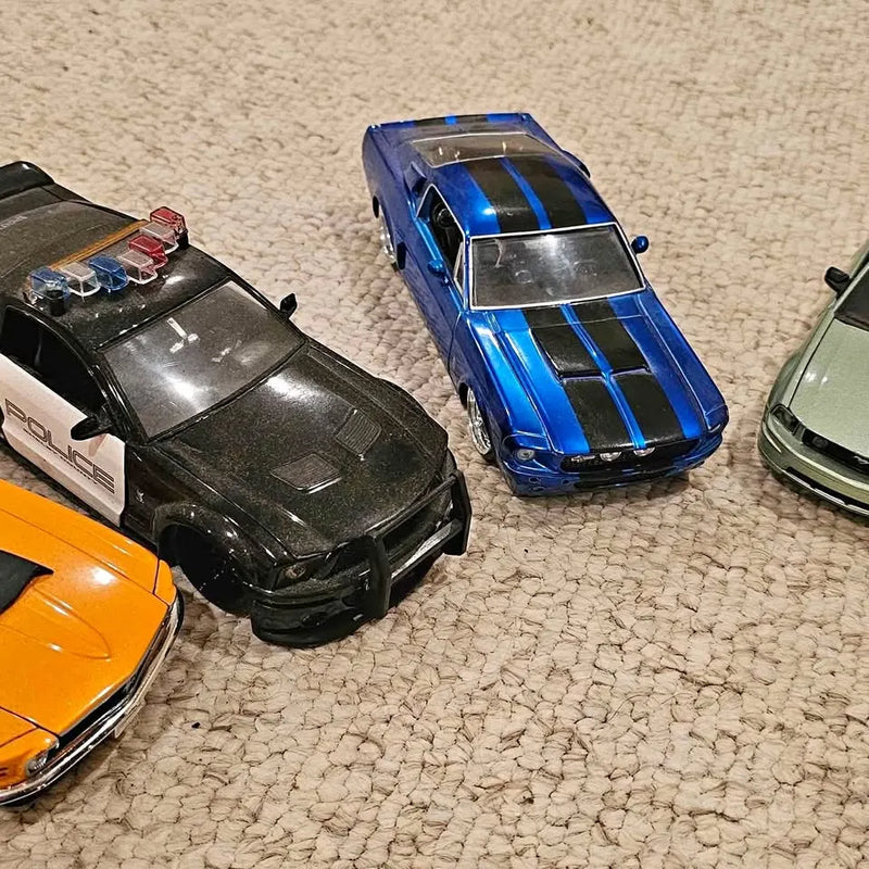 Diecast sports car set: blue, black, orange and green Mustang models, 1:24 scale