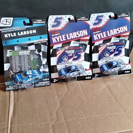 Diecast race car model in Kyle Larson branded box, scale 1:64, shown from front