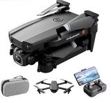 Gray quadcopter drone with camera, remote controller, and carrying case