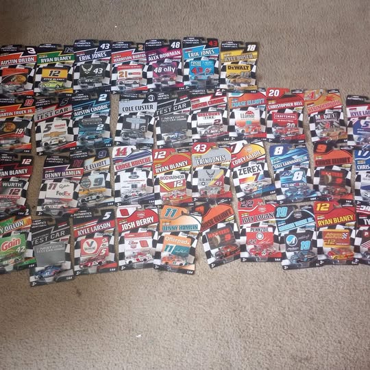 Assorted NASCAR diecast race car models lot, various designs and numbers